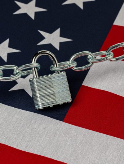 American flag secured with a chain and padlock | Immigration Lawyers | The Berdugo Law Firm